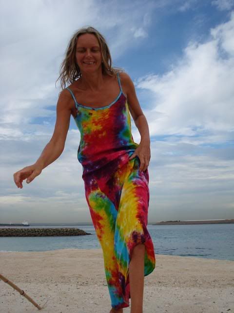 Kveta in her selfmade rainbow dress, on the beach