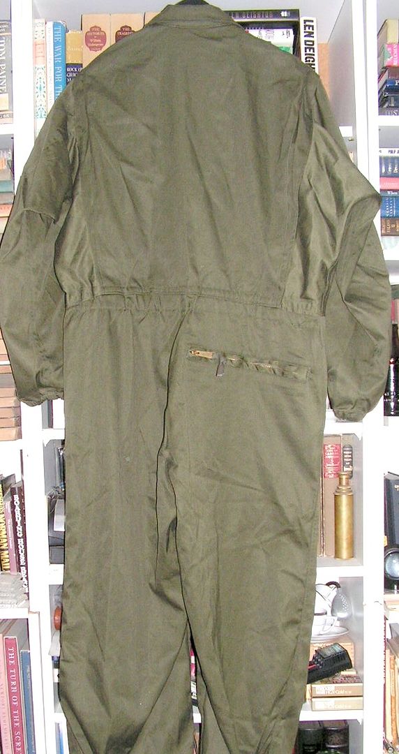 Coverall is new, unused. Its very roomy, being designed to be worn 