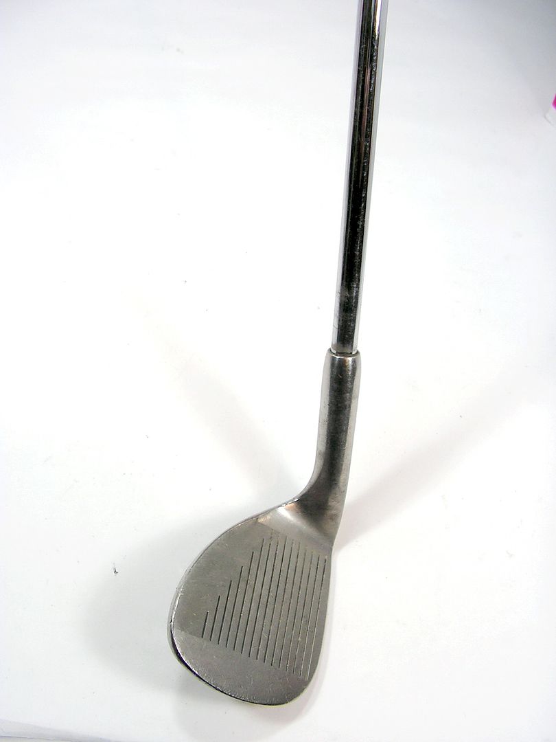 Club is in good condition with wear to lower grooves & sole & a few 